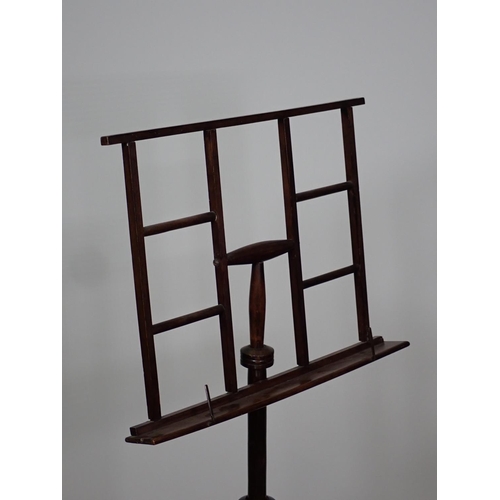 430 - An Aesthetic movement mixed wood adjustable Music Stand on three turned supports