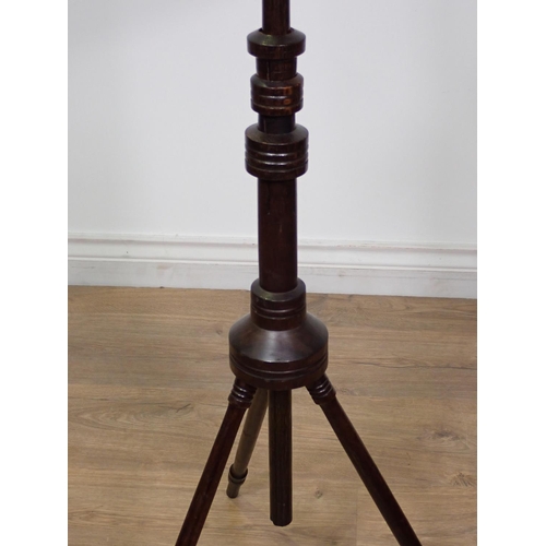 430 - An Aesthetic movement mixed wood adjustable Music Stand on three turned supports