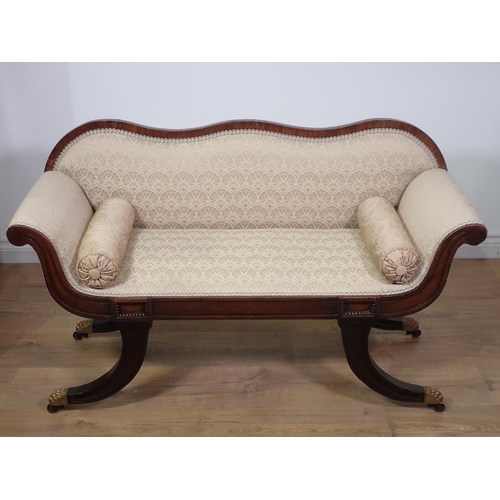 434 - A Regency style Window Seat in the form of a scroll-end Settee with shaped back, scrolled arms and s... 