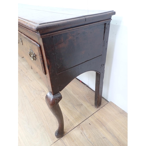 435 - An 18th Century oak Dresser Base with three drawers above a shaped frieze on cabriole front legs, 6f... 