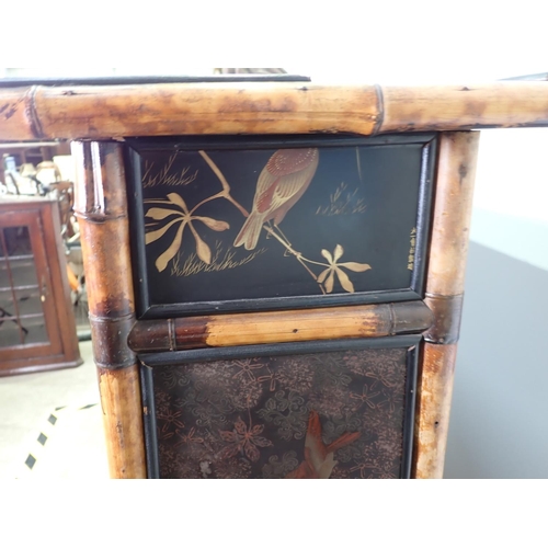 437 - A 19th Century bamboo and ebonised and glazed two door Bookcase enclosing painted fixed shelves fitt... 