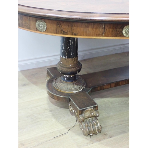 455 - A Regency rosewood Centre Table with moulded oval top, raised on cheval base of two painted and gild... 