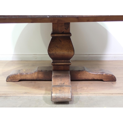 462 - A Trevor Lawrence oak circular Dining Table on squared baluster column and cross supports, 5ft 6in D... 