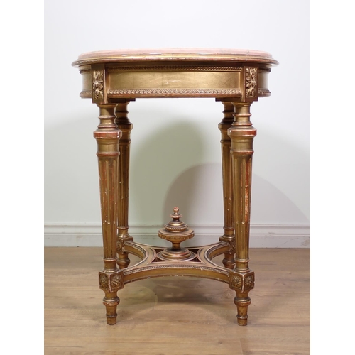 472 - A gilt circular Centre Table with pink veined marble top, the base with four fluted turned supports ... 