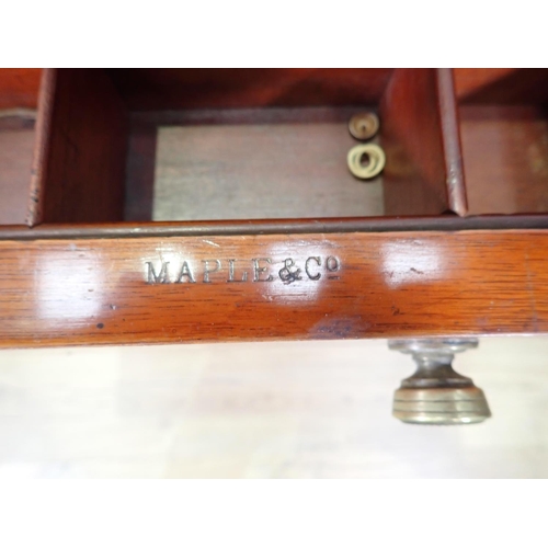 478 - A satinwood ladies Writing Desk by Maple & Co. with fall front, and fitted frieze drawer on squared ... 