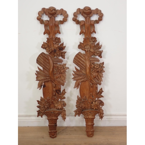 486 - A pair of 19th Century carved pine Wall Appliques with tied ribbon crests above trailing flower and ... 