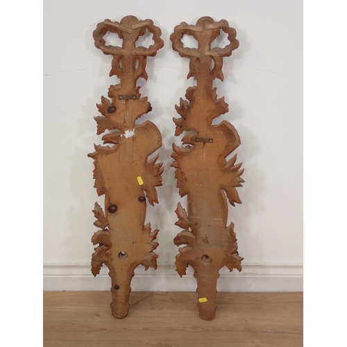 486 - A pair of 19th Century carved pine Wall Appliques with tied ribbon crests above trailing flower and ... 