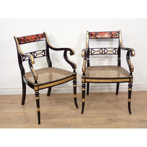 489 - A set of four decorated Regency style Armchairs, the pierced bar backs and swept scroll arms above c... 