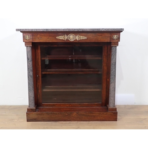 496 - A Regency rosewood Pier Cabinet with granite top and turned columns flanking single glazed door, fit... 