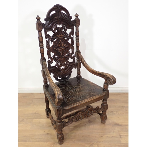 499 - A large Victorian carved high back Elbow Chair with carved and scrolled back, scrolled arms and carv... 