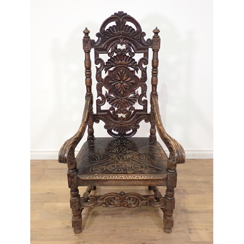 499 - A large Victorian carved high back Elbow Chair with carved and scrolled back, scrolled arms and carv... 