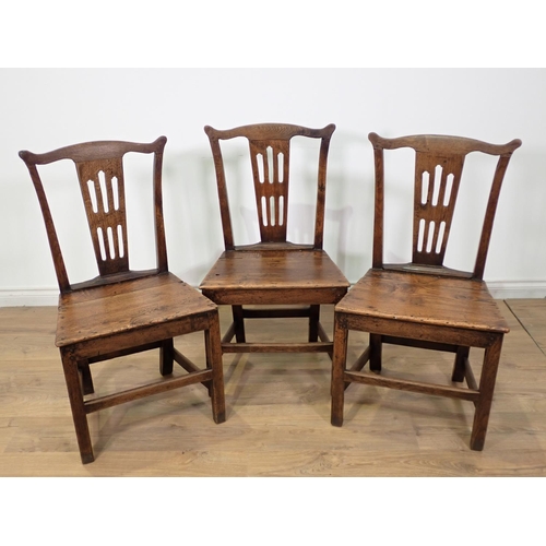 500 - A set of three 18th Century oak Dining Chairs with pierced splat backs, solid seats on squared suppo... 