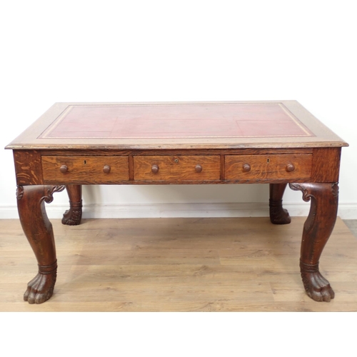 505 - A Victorian oak Library Desk with moulded top, inset writing surface fitted three frieze drawers and... 