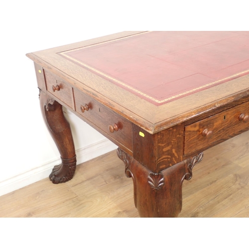 505 - A Victorian oak Library Desk with moulded top, inset writing surface fitted three frieze drawers and... 