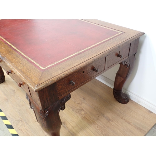 505 - A Victorian oak Library Desk with moulded top, inset writing surface fitted three frieze drawers and... 