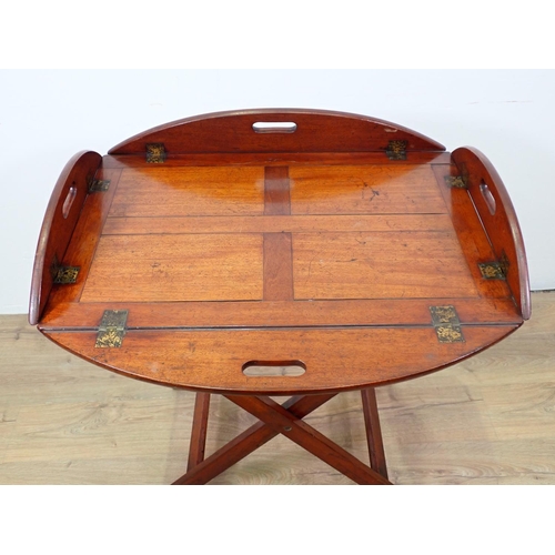 532 - A 19th Century mahogany Butler's Tray on stand, the tray having four folding sides with pierced hand... 