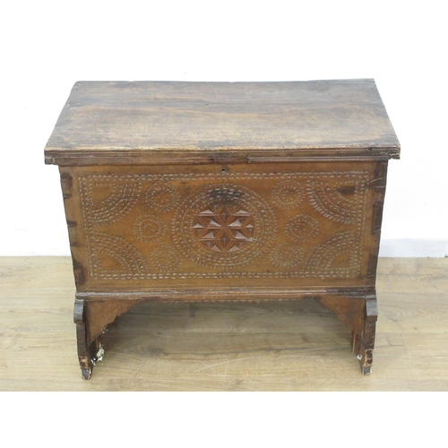 533 - A small 18th Century Continental walnut Coffer with hinged cover, carved front and on shaped support... 