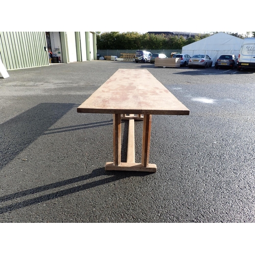 535 - Gordon Russell, A long oak Refectory Table with  six chamfered supports and 