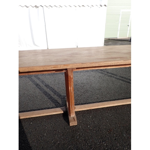 535 - Gordon Russell, A long oak Refectory Table with  six chamfered supports and 