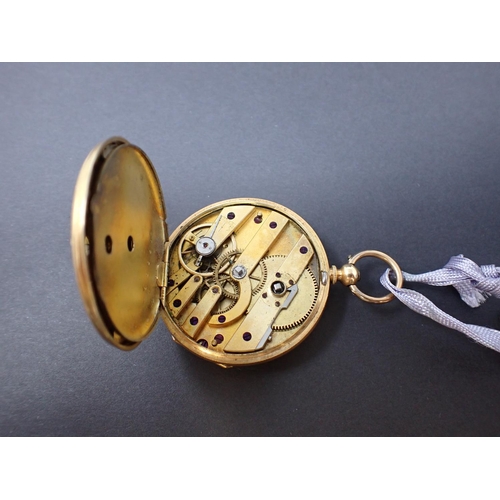 64 - A Continental 18ct gold cased open faced key wind Fob Watch the floral engraved dial with roman nume... 