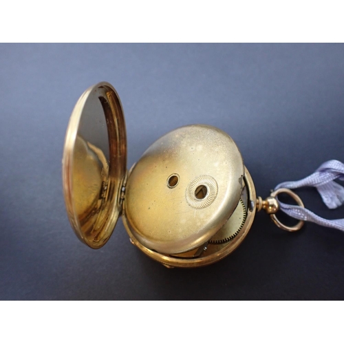 64 - A Continental 18ct gold cased open faced key wind Fob Watch the floral engraved dial with roman nume... 