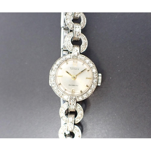 78 - A lady's Turnex Diamond Cocktail Watch the silvered dial with arabic numerals at 12 and 6 remainder ... 