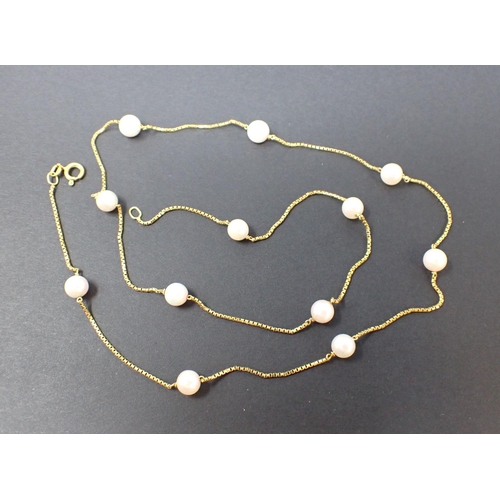 81 - A Cultured Pearl Necklace on fine box-link chain in 14ct gold, approx 57cms, approx 7.80gms