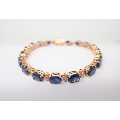 84 - A Sapphire and Diamond line Bracelet claw-set nineteen oval-cut sapphires, total sapphire weight 16.... 