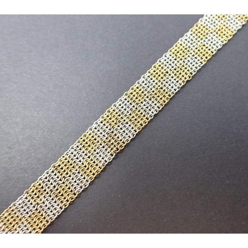 98 - A yellow and white gold chain link chequered effect Bracelet, marked 15ct approx 18cms long, approx ... 