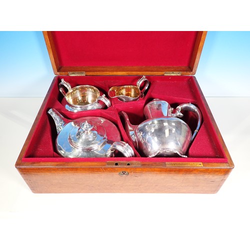 1 - A matched George IV/Victorian silver four piece Tea and Coffee Service of circular form engraved ini... 