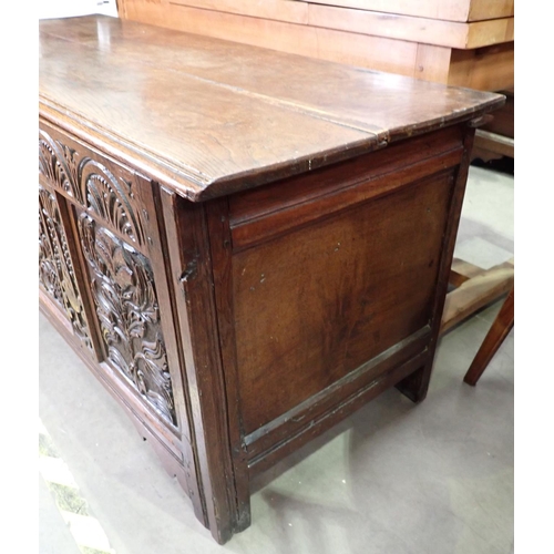 387 - A 17th Century oak Dower Chest with plank lid above arcaded frieze and three floral and leafage carv... 