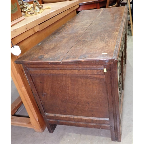 387 - A 17th Century oak Dower Chest with plank lid above arcaded frieze and three floral and leafage carv... 