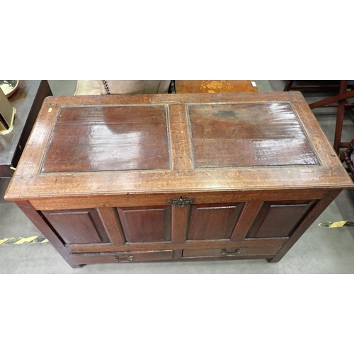 388 - An 18th Century oak Mule Chest with plain 2-panel lid above four plain fielded panel front above two... 