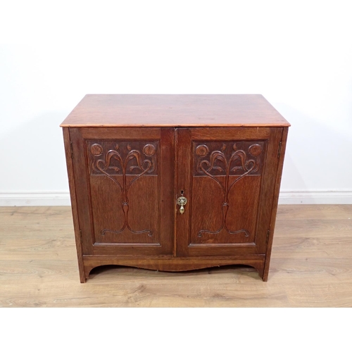 108 - An oak two door Cupboard with foliate carving 2ft 10in x 2ft 6in