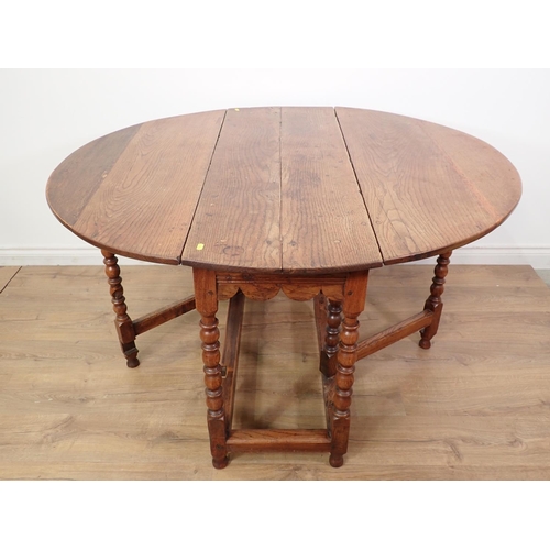 120 - An antique oak Gateleg Table in the 17th Century style mounted upon bobbin turned supports 4ft x 2ft... 