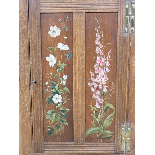 123 - An antique oak hanging Corner Cupboard with floral painted decoration 2ft 10in x 2ft 1in