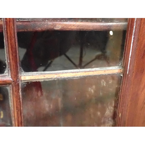 125 - An antique oak and glazed hanging Corner Cabinet 3ft 2in x 2ft 4in