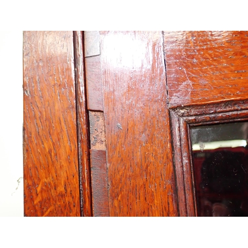 125 - An antique oak and glazed hanging Corner Cabinet 3ft 2in x 2ft 4in