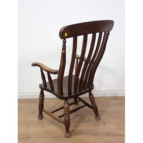 130 - An antique ash lath back Kitchen Armchair 3ft 5in x 2ft