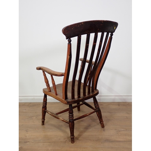 131 - An antique ash lath back Kitchen Armchair 3ft 7in x 2ft