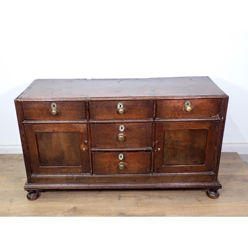 138 - An 18th Century and later oak Dresser Base fitted three frieze drawers above pair of panelled cupboa... 