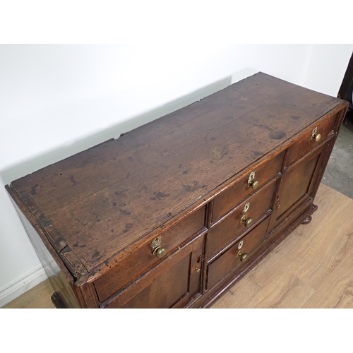 138 - An 18th Century and later oak Dresser Base fitted three frieze drawers above pair of panelled cupboa... 