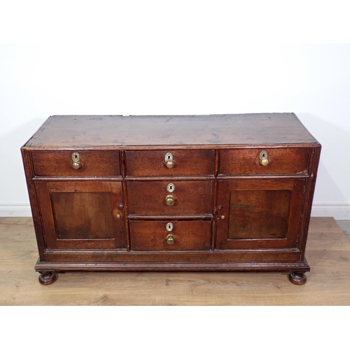 138 - An 18th Century and later oak Dresser Base fitted three frieze drawers above pair of panelled cupboa... 