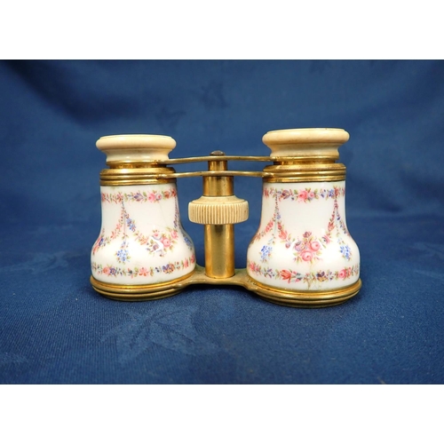 149 - A pair of gilt metal Opera Glasses with floral decorated enamel mounts by Howell James & Co