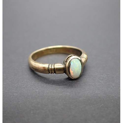 161 - An Opal single stone Ring rubover-set oval cabochon in 18ct gold, ring size Q, approx 5gms