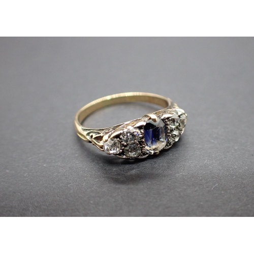 162 - A Victorian boat shaped Ring pavé-set step-cut blue stone between trios of old-cut diamonds ring siz... 