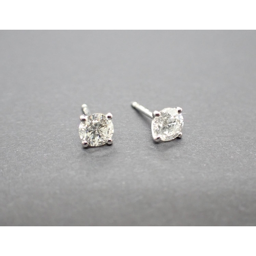 167 - A pair of Diamond Ear Studs each claw-set brilliant-cut stone, total diamond weight 1.04cts, in 18ct... 