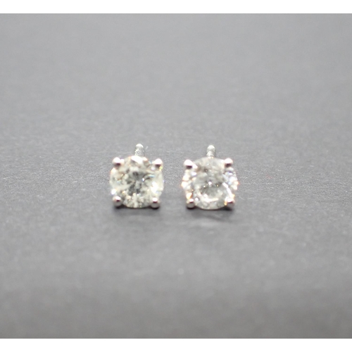 167 - A pair of Diamond Ear Studs each claw-set brilliant-cut stone, total diamond weight 1.04cts, in 18ct... 