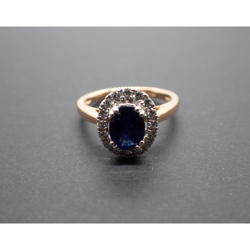 168 - A Sapphire and Diamond Cluster Ring claw-set oval-cut sapphire, 1.32cts, within a frame of pavé-set ... 