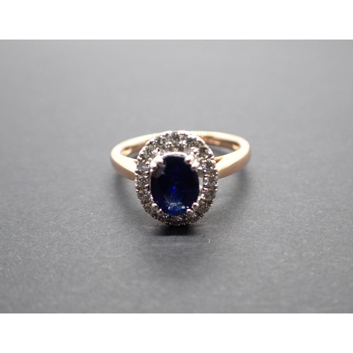 168 - A Sapphire and Diamond Cluster Ring claw-set oval-cut sapphire, 1.32cts, within a frame of pavé-set ... 